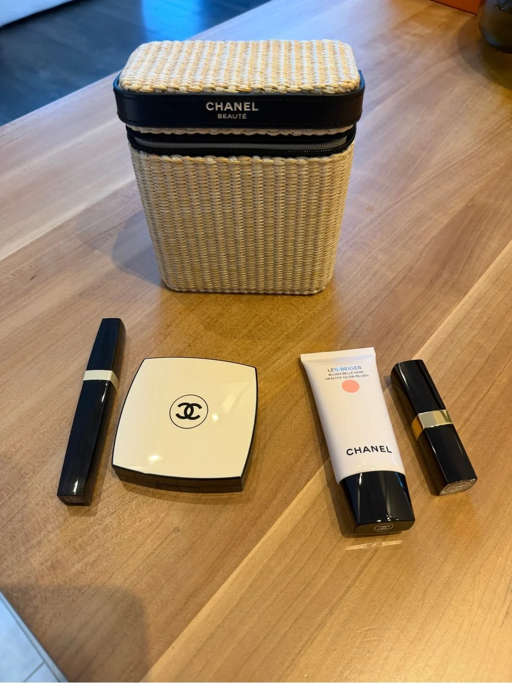 CHANEL Straw Cosmetic Case in Natural and Black with products